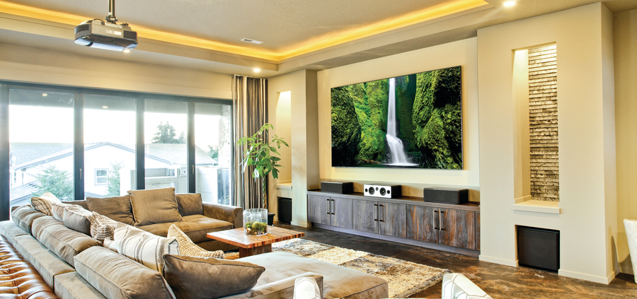 a living room with a projector, lighting, and audio system